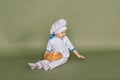 Portrait of a little boy cook at kitchen. Different occupations. Isolated over white background Royalty Free Stock Photo