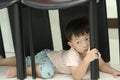 Little boy crawling under the chair.Playful time