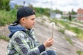 Portrait of a little boy with a dandelion in his hand Royalty Free Stock Photo