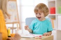 Portrait of little boy drawing something for art class Royalty Free Stock Photo