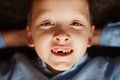 Portrait little boy in fall missing his first milk tooth. Royalty Free Stock Photo