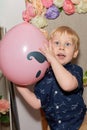 Portrait of a little boy holding a big pink balloon Royalty Free Stock Photo