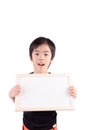 Portrait of a little boy holding a whiteboard