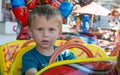 Portrait of little boy in a merry-go-round Royalty Free Stock Photo