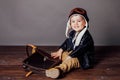 Portrait of a beautiful little boy in a plane pilot costume Royalty Free Stock Photo