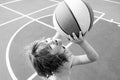 Portrait of little boy play basketball. Concept of kids sports.