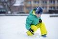 Portrait of little boy playing with snow in winter Royalty Free Stock Photo