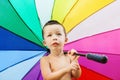 Portrait of the little boy with rainbow colors umbrella Royalty Free Stock Photo