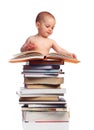 Portrait of a little boy standing behind a stack o Royalty Free Stock Photo