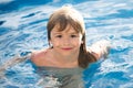 Portrait of little boy swim in sea. Kid laughing in water of waves at sea. Funny kids face. Royalty Free Stock Photo