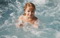 Portrait of little boy swim in sea. Kid laughing in water of waves at sea. Funny kids face. Royalty Free Stock Photo