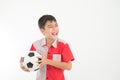 Portrait of little boy take a foot ball in the hand on white