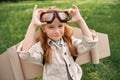 portrait of little child in pilot costume wearing protective eyeglasses