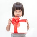 Portrait of little cute asian girl holding box of Christmas present Royalty Free Stock Photo