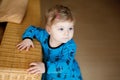 Portrait of little cute baby girl learning walking and standing. Adorable toddler girl at home Royalty Free Stock Photo