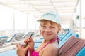 Portrait of little cute blond caucasian child girl enjoy having fun relax drinking mojito lemonade chilling at seaside Royalty Free Stock Photo