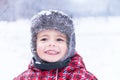 Portrait of a little cute boy on winter background. Royalty Free Stock Photo