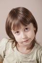 Portrait of little cute child girl with a skeptical look as if she want to tell: Please respect the rights of children Royalty Free Stock Photo