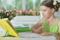 Portrait of little cute girl doing homework at home Royalty Free Stock Photo