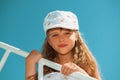 Portrait of little cute girl enjoying playing on boat Royalty Free Stock Photo