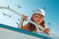 Portrait of little cute girl enjoying playing on boat Royalty Free Stock Photo