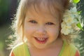 Portrait of a little cute girl with a jasmine flower in her hair Royalty Free Stock Photo