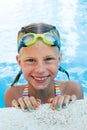 Portrait of little cute girl in the swimming pool. Royalty Free Stock Photo