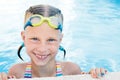 Portrait of little cute girl in the swimming pool. Royalty Free Stock Photo