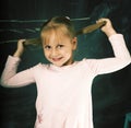 Portrait of little cute girl writing on the blackboard in classroom, lifestyle education people concept Royalty Free Stock Photo