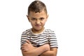 Portrait of a little frowning boy on a white background. Emotions Royalty Free Stock Photo