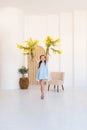 Portrait of a little girl with a bouquet of spring yellow flowers Royalty Free Stock Photo