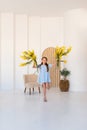 Portrait of a little girl with a bouquet of spring yellow flowers Royalty Free Stock Photo