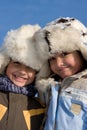 Portrait of little girl and boy in the fur-cap Royalty Free Stock Photo