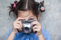 Portrait of a little girl with camera