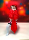 Portrait of little girl in carnival costume on abstract background