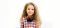 Portrait of little girl child with headphones listening to music Royalty Free Stock Photo