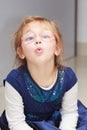 Portrait little girl child making funny face doing fun Royalty Free Stock Photo
