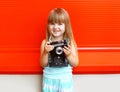 Portrait of little girl child with old retro vintage camera Royalty Free Stock Photo