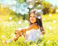Portrait of little girl child playing with soap bubbles in sunny summer day Royalty Free Stock Photo