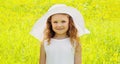 Portrait little girl child in spring field with dandelions flowers Royalty Free Stock Photo