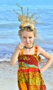 Portrait of a little girl with a coral crown on her head Royalty Free Stock Photo