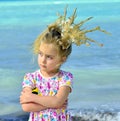 Portrait of a little girl with a coral crown Royalty Free Stock Photo