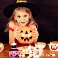 Portrait of little girl in costume witch on Halloween Royalty Free Stock Photo