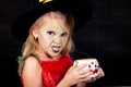 Portrait of little girl in costume witch on Halloween Royalty Free Stock Photo