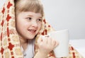 Portrait of a little girl covering with a rug Royalty Free Stock Photo