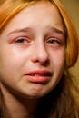 Portrait of little girl crying with tears rolling down her cheeks. Girl crying. Girl 9 years old is very upset. Teenage Royalty Free Stock Photo