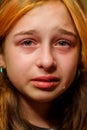 Portrait of little girl crying with tears rolling down her cheeks. Girl crying. Girl 9 years old is very upset. Teenage Royalty Free Stock Photo