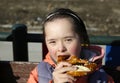 Portrait of little girl eating pretzel Royalty Free Stock Photo