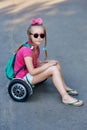 Portrait of a little girl on an ecological electric vehicle Royalty Free Stock Photo
