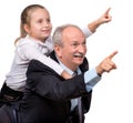 Portrait of a little girl enjoying piggyback ride with her grand Royalty Free Stock Photo